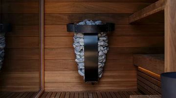  Calefactor eléctrico para sauna con piedras volcánicas, instalado en la pared de un sauna seco de madera